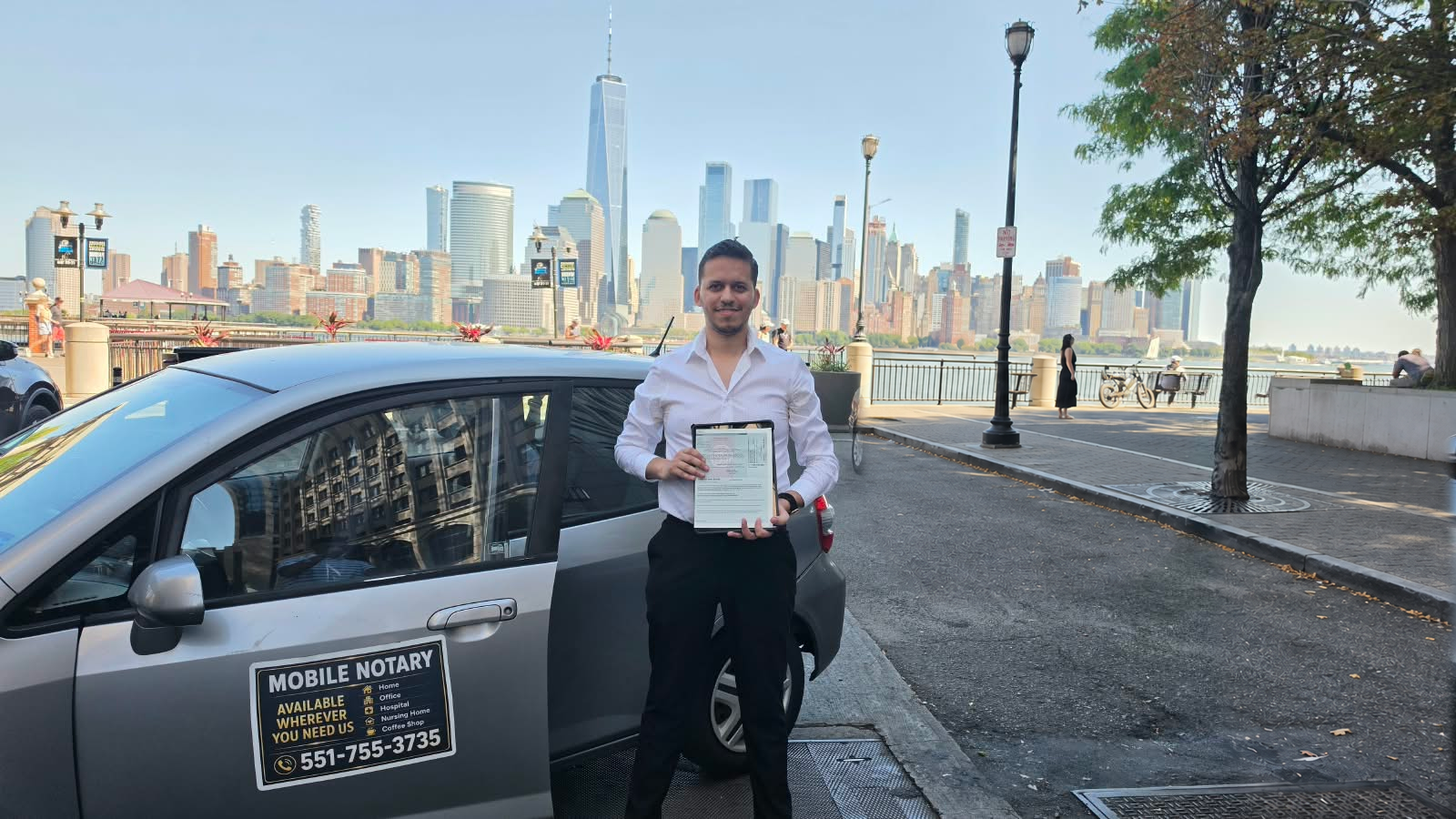 Your mobile notary beside his branded vehicle on the Hudson waterfront